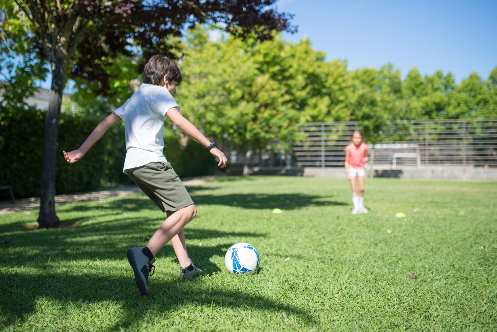 Teenagers playing football